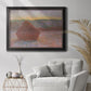 Impressionist haystack sunset scene in winter by Claude Monet in an ornate black frame with gilded inner detail displayed in a bright interior setting.