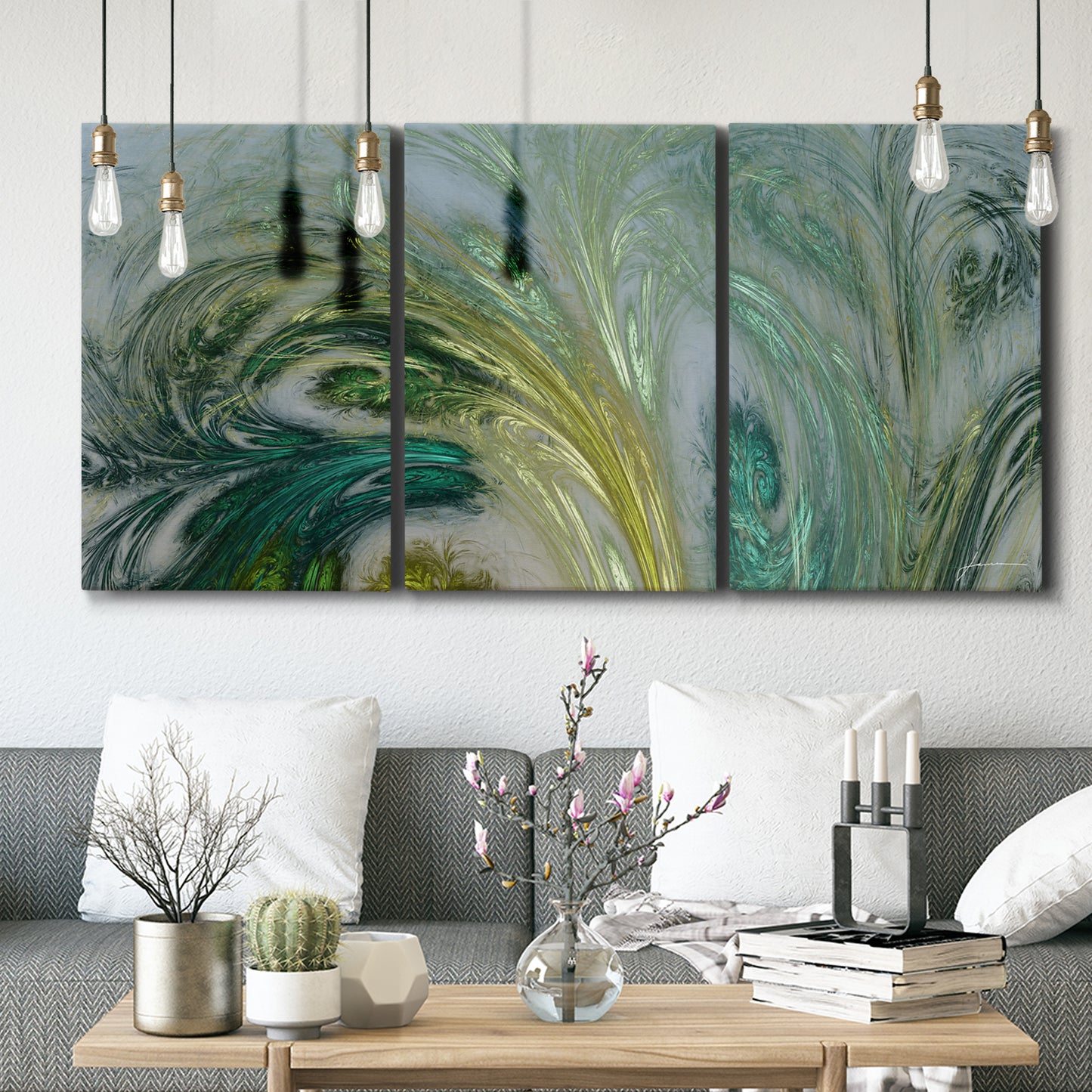 Three-panel canvas wall art featuring layered modern abstract landscape, displayed in a modern living room above seating.