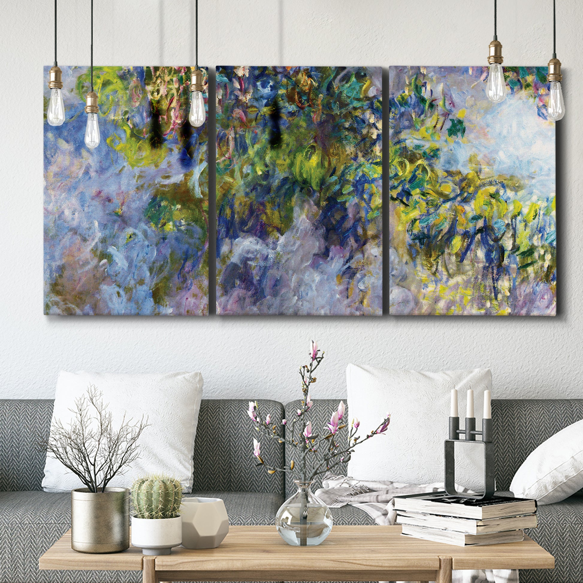 Three-panel canvas wall art featuring cascading purple wisteria blooms, displayed in a modern living room above seating.