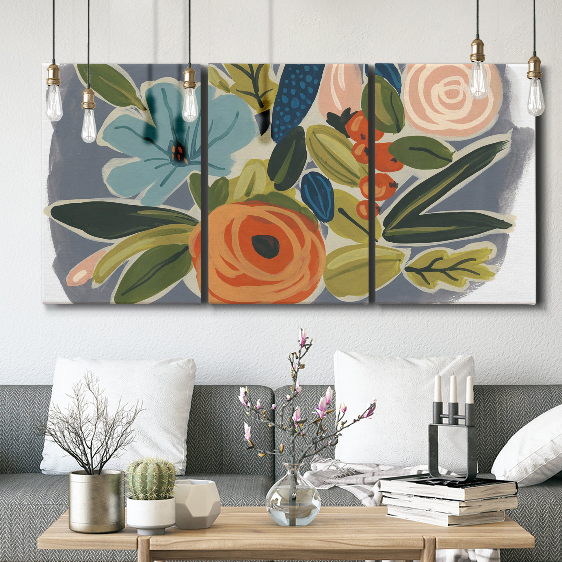 Three-panel canvas wall art featuring colorful botanical illustration, displayed in a modern living room above seating.
