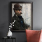 Impressionist portrait of a seated man by Édouard Manet in an ornate black frame with gilded inner detail displayed in a dark-toned interior setting.