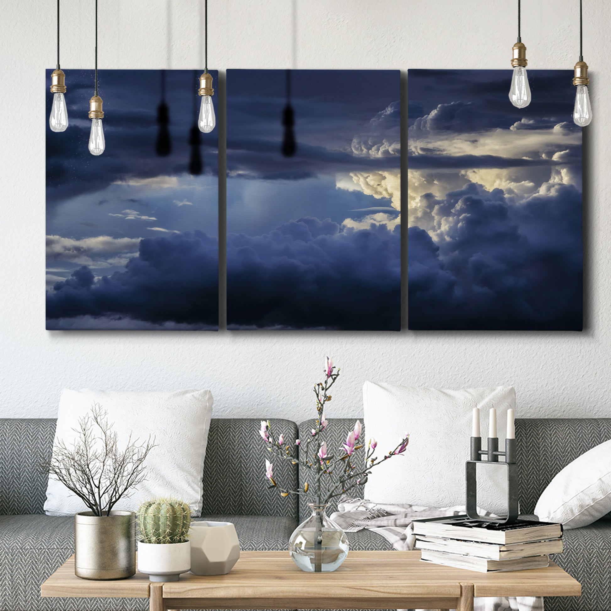 Three-panel canvas wall art featuring hot air balloons rising at dawn, displayed in a modern living room above seating.