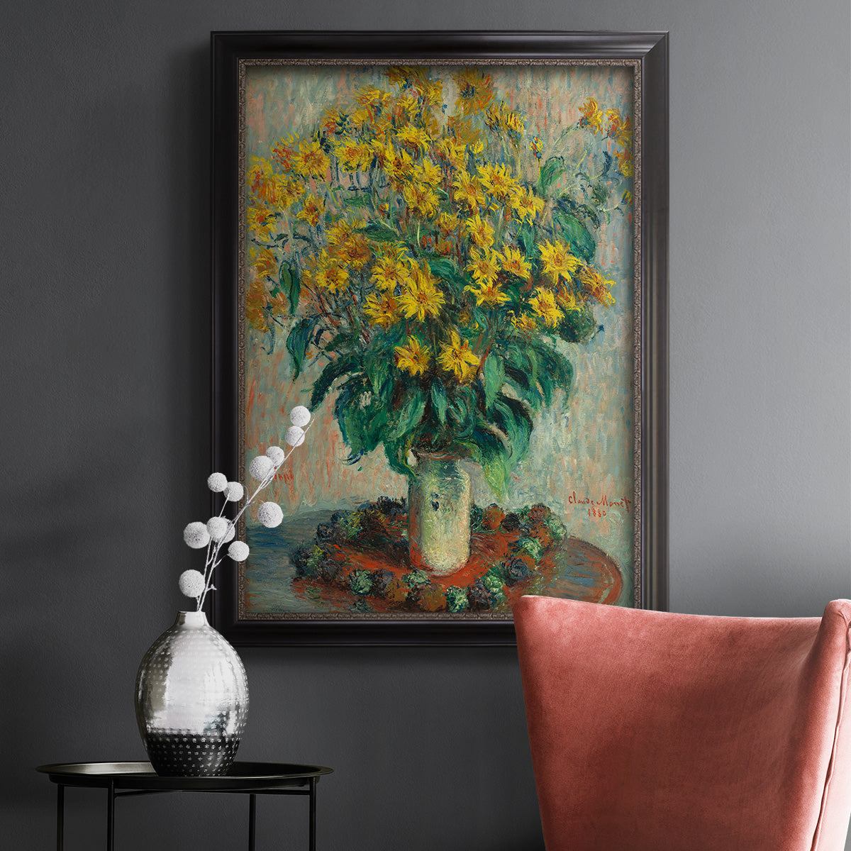 Impressionist floral painting of artichoke flowers by Claude Monet in an ornate black frame with gilded inner detail displayed in a dark-toned interior setting.
