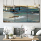Three-panel canvas wall art featuring rocky coastal bluff above sea, displayed in a modern living room above seating.