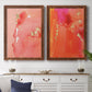 Set of two maple barnwood framed canvas prints depicting a coordinated art pair of luminous coral orange and pink color fields with gold flecks rendered as glamorous fluid abstracts above a dining room sideboard.