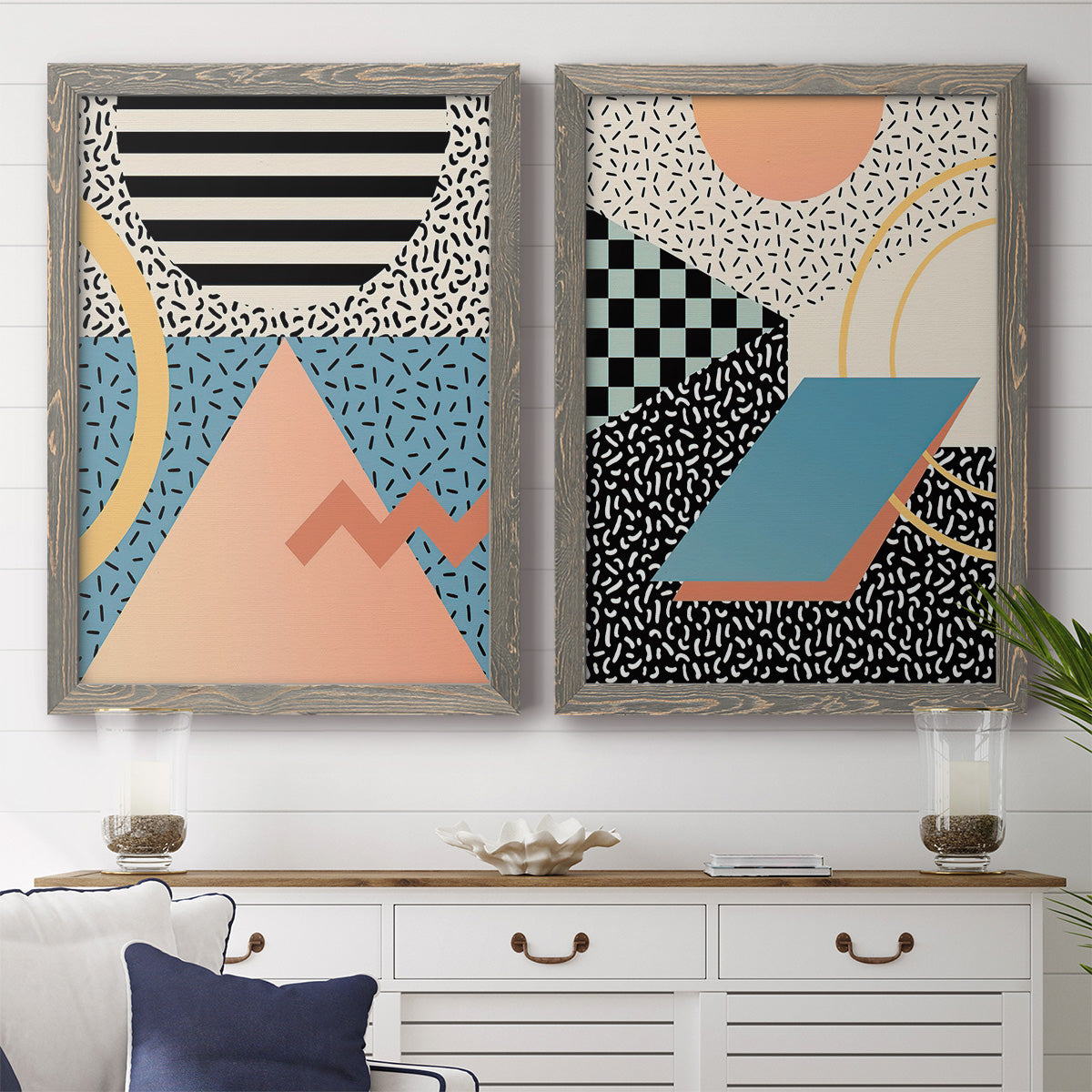 Set of two gray barnwood framed canvas prints depicting a coordinated art pair of bold geometric Memphis-style patterns rendered as retro graphic abstracts above a dining room sideboard.