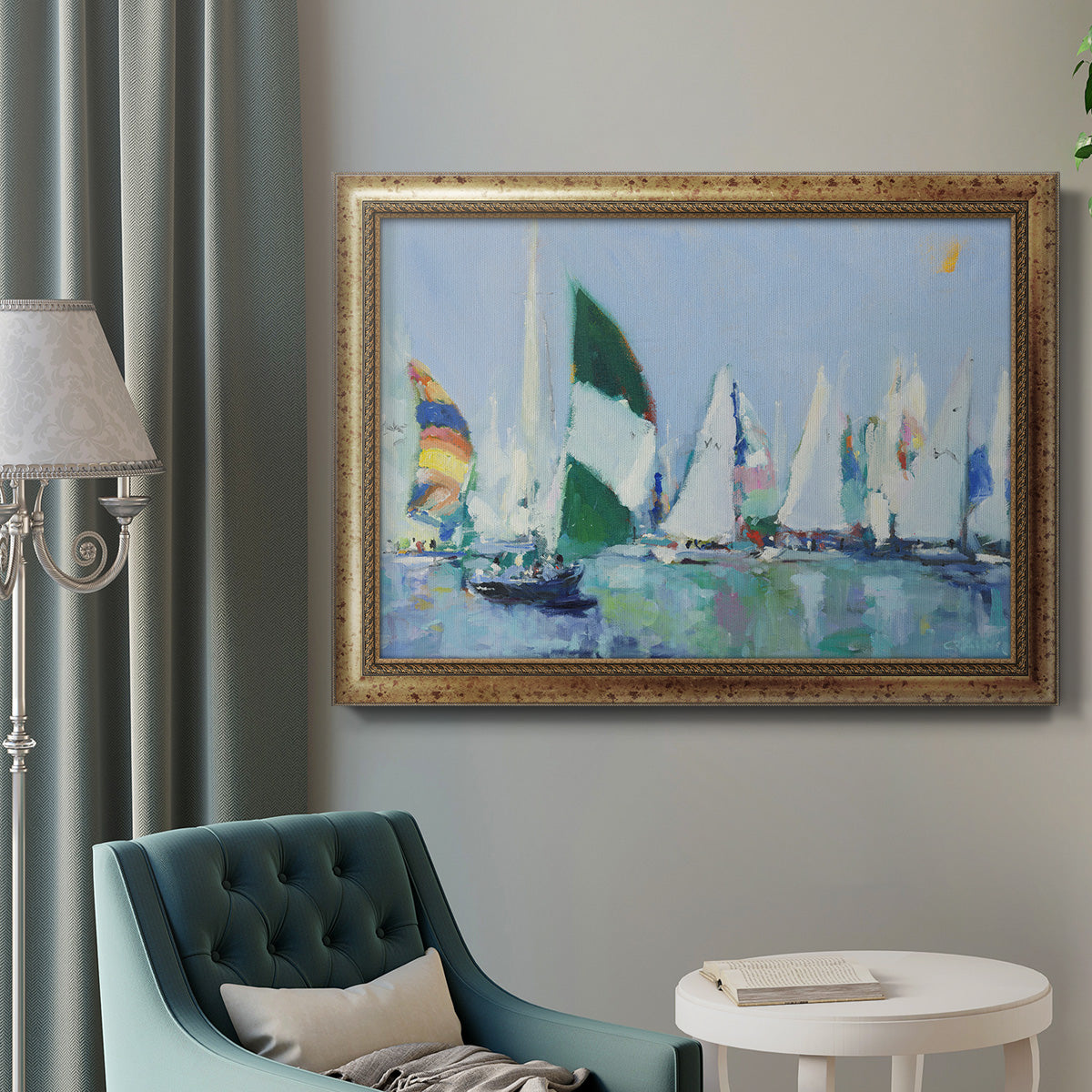Coastal harbor watercolor painting in an ornate vintage gold frame displayed in a neutral interior setting.
