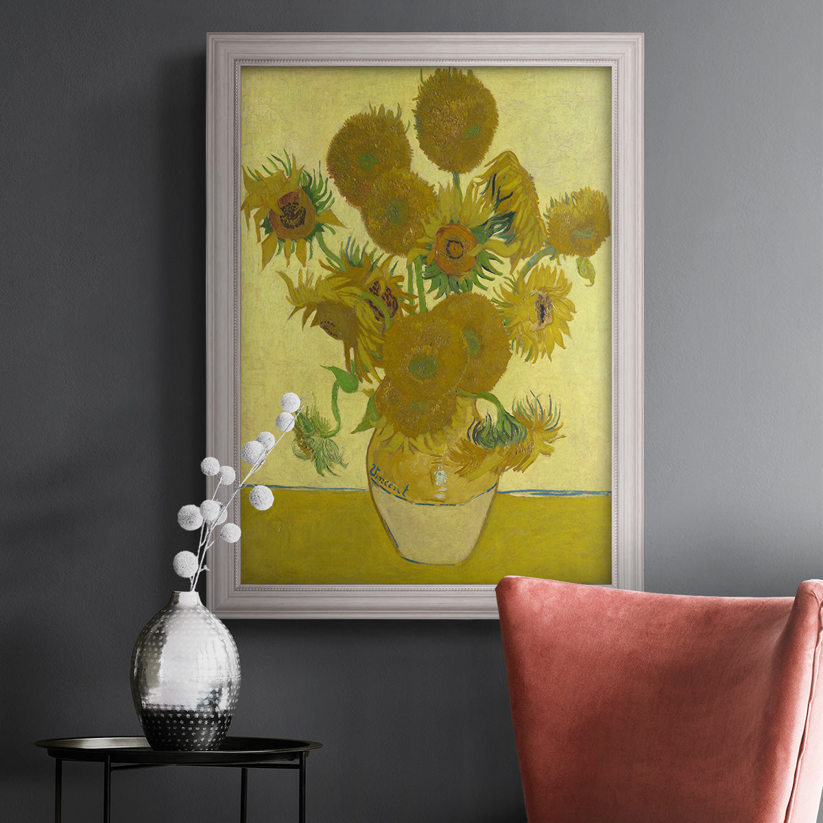Impressionist sunflower still life painting by Vincent van Gogh in an ornate weathered white frame displayed in a dark-toned interior setting.