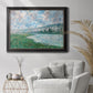 Impressionist river landscape at Vétheuil by Claude Monet in an ornate black frame with gilded inner detail displayed in a bright interior setting.