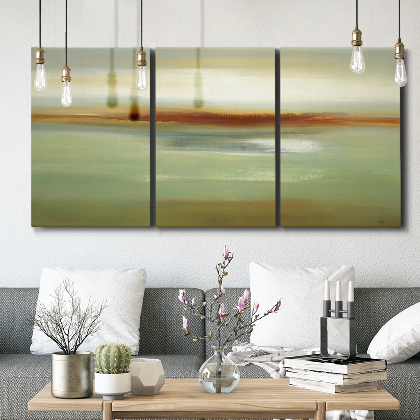 Three-panel canvas wall art featuring green focused abstract color vision, displayed in a modern living room above seating.