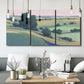 Three-panel canvas wall art featuring pastoral countryside with rocky outcrop, displayed in a modern living room above seating.