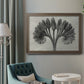 Vintage botanical plant study photograph by Karl Blossfeldt in an ornate traditional bronze frame displayed in a neutral interior setting.