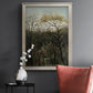 Dreamlike forest landscape scene by Henri Rousseau in an ornate champagne frame displayed in a dark-toned interior setting.
