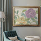 Contemporary peony flower illustration in an ornate vintage gold frame displayed in a neutral interior setting.