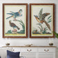 Set of two maple barnwood framed canvas prints depicting a coordinated art pair of misty blue gray and violet marks hovering across pale grounds rendered as atmospheric abstract paintings above a dining room sideboard.