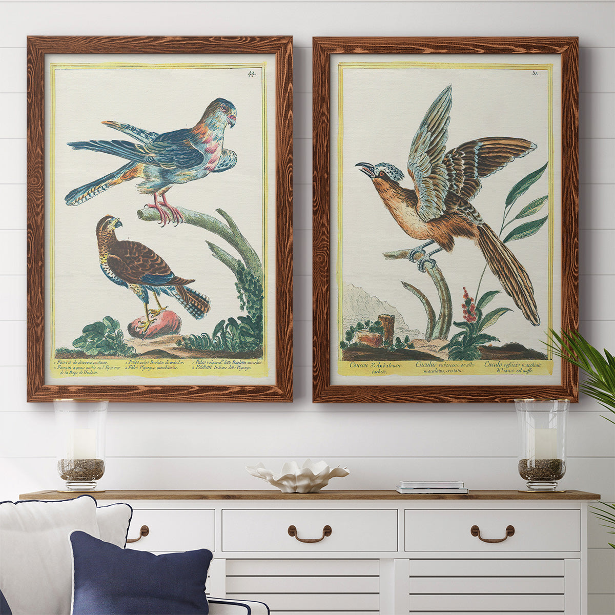 Set of two maple barnwood framed canvas prints depicting a coordinated art pair of misty blue gray and violet marks hovering across pale grounds rendered as atmospheric abstract paintings above a dining room sideboard.