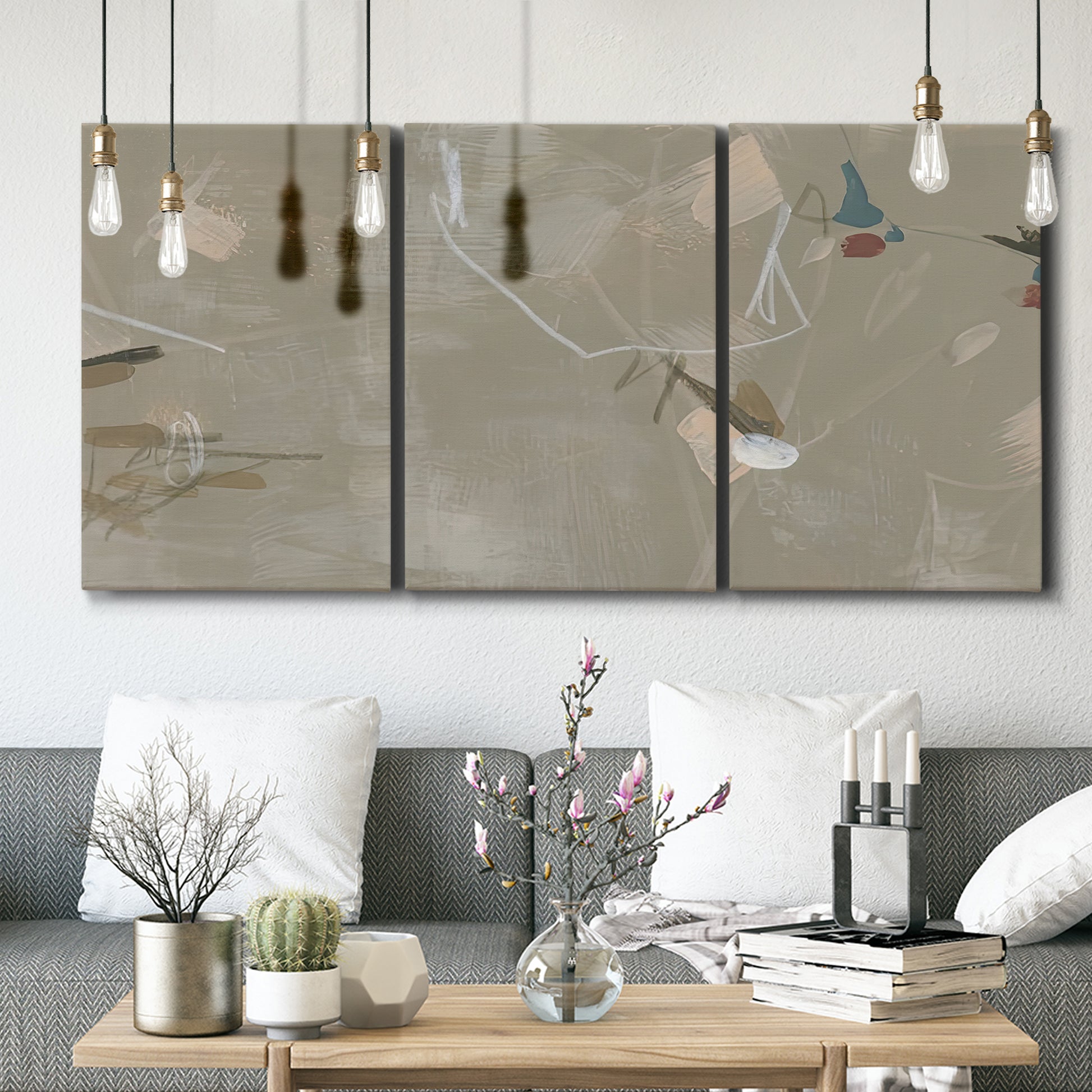 Three-panel canvas wall art featuring mid century terrazzo inspired abstraction, displayed in a modern living room above seating.