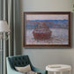 Impressionist single haystack landscape by Claude Monet in an ornate bronzed mahogany wood frame displayed in a bright interior setting.