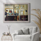 Impressionist café still life scene by Édouard Manet in an ornate weathered white frame displayed in a bright interior setting.