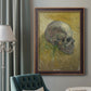 Profile skull study artwork by Vincent van Gogh in an ornate bronzed mahogany wood frame displayed in a dark-toned interior setting.