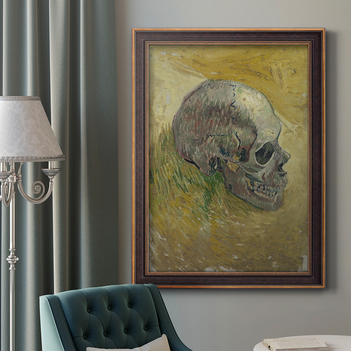 Profile skull study artwork by Vincent van Gogh in an ornate bronzed mahogany wood frame displayed in a dark-toned interior setting.