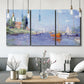 Three-panel canvas wall art featuring river flowing past riverside town, displayed in a modern living room above seating.