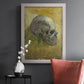 Profile skull study artwork by Vincent van Gogh in an ornate weathered white frame displayed in a dark-toned interior setting.