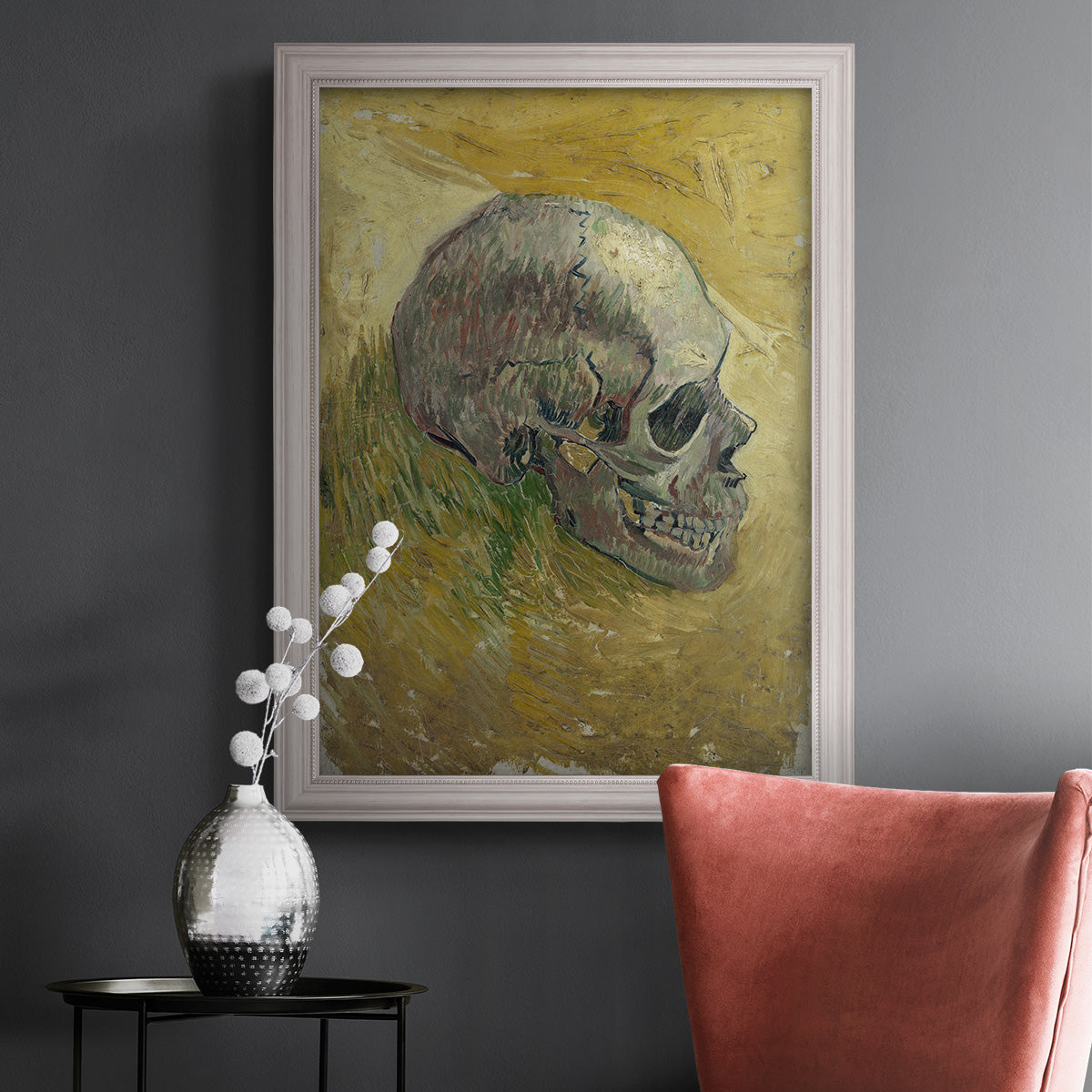 Profile skull study artwork by Vincent van Gogh in an ornate weathered white frame displayed in a dark-toned interior setting.
