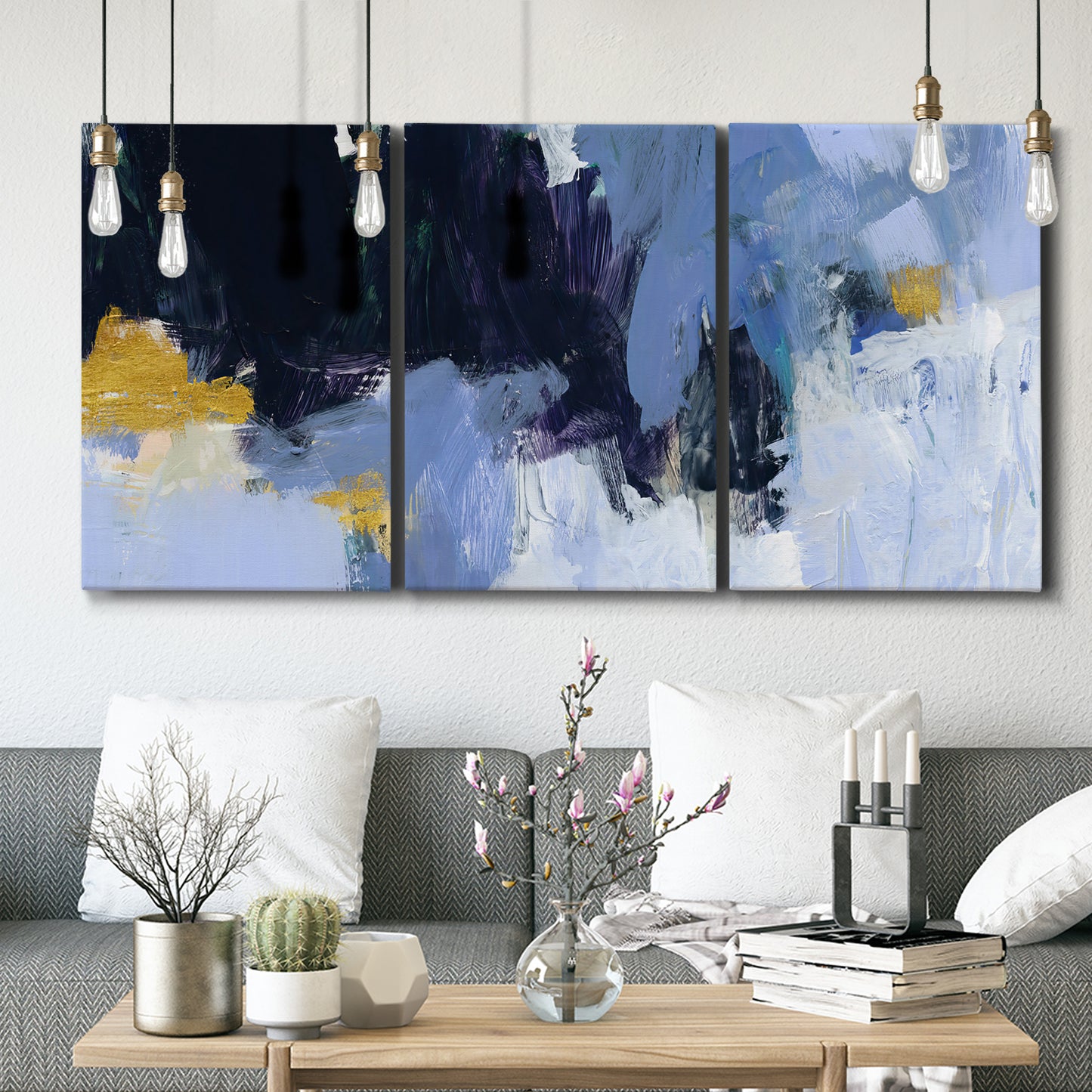 Three-panel canvas wall art featuring icy abstract arctic ledge, displayed in a modern living room above seating.