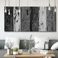 Three-panel canvas wall art featuring brushed metallic abstract textures, displayed in a modern living room above seating.