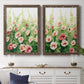 Set of two walnut barnwood framed canvas prints depicting a coordinated art pair of a field of pink coral and white flowers rendered as luminous impressionistic floral paintings above a dining room sideboard.