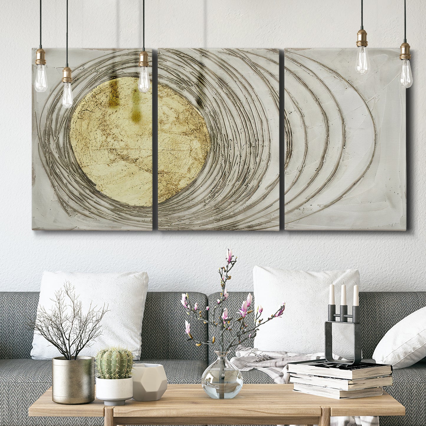 Three-panel canvas wall art featuring circular abstract energy forms, displayed in a modern living room above seating.