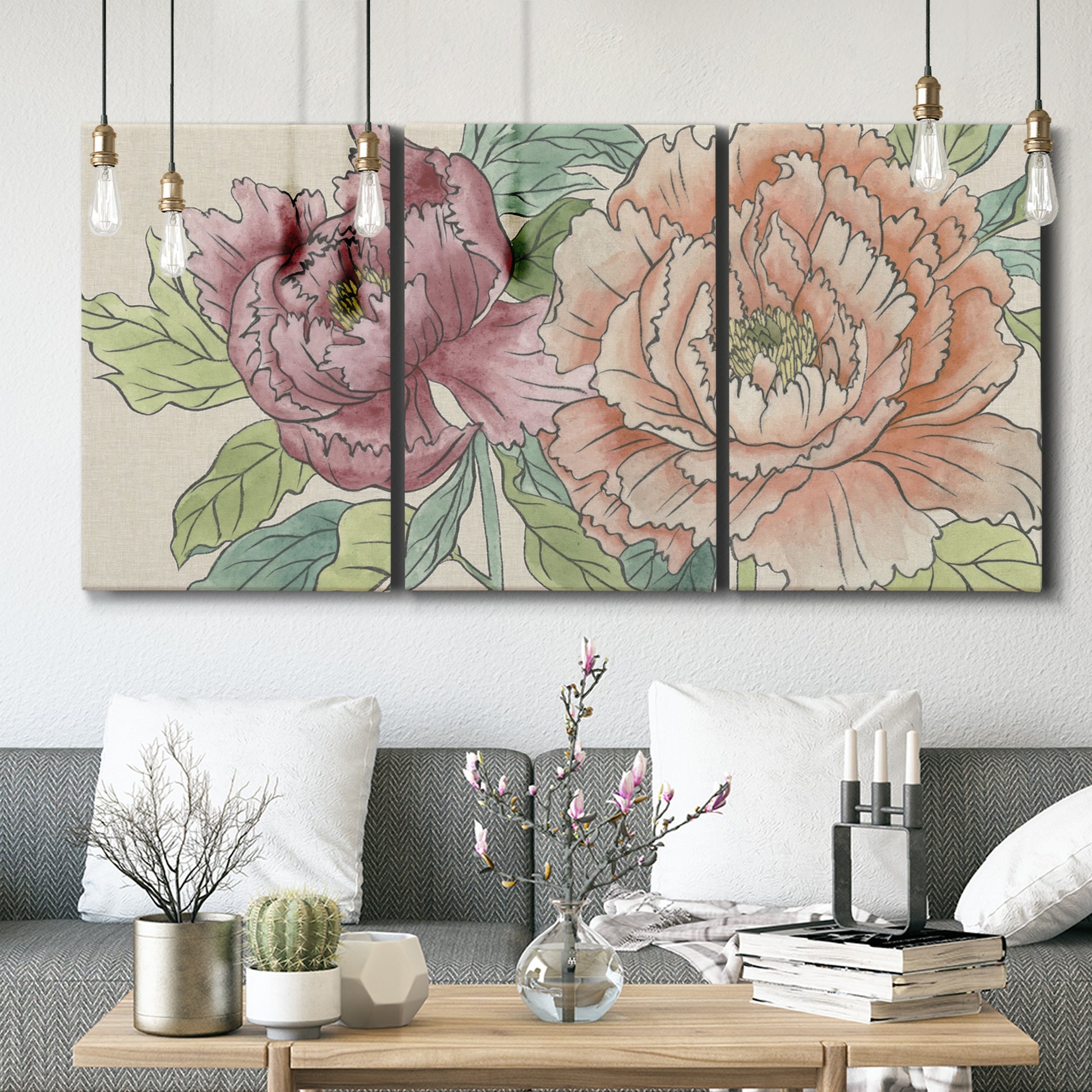 Three-panel canvas wall art featuring pastel peony flower composition, displayed in a modern living room above seating.