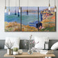 Three-panel canvas wall art featuring coastal village view near dieppe, displayed in a modern living room above seating.