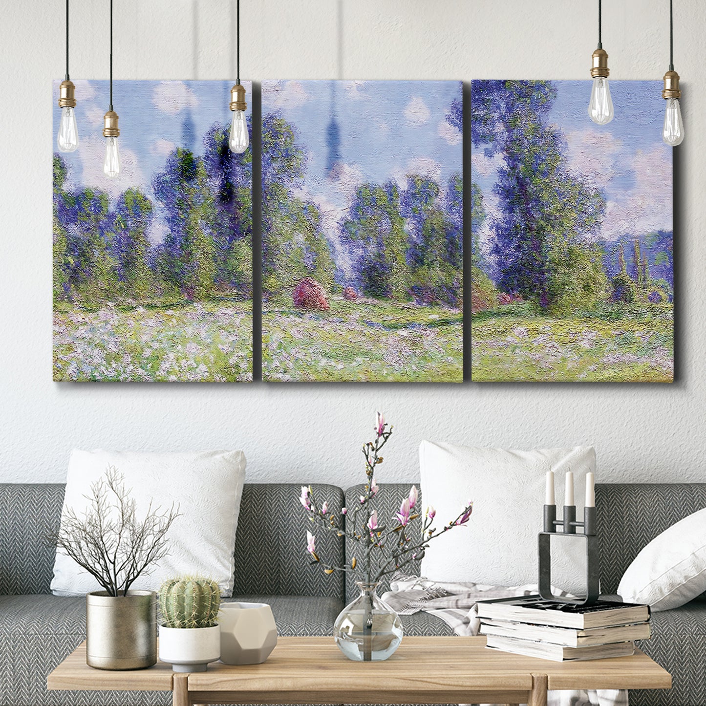 Three-panel canvas wall art featuring poppy field near garden village, displayed in a modern living room above seating.