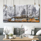 Three-panel canvas wall art featuring winter village street photography, displayed in a modern living room above seating.