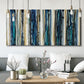 Three-panel canvas wall art featuring vertical blue abstract streaks, displayed in a modern living room above seating.