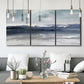 Three-panel canvas wall art featuring abstract coastal tones and movement, displayed in a modern living room above seating.
