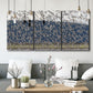 Three-panel canvas wall art featuring group of animals in open field, displayed in a modern living room above seating.