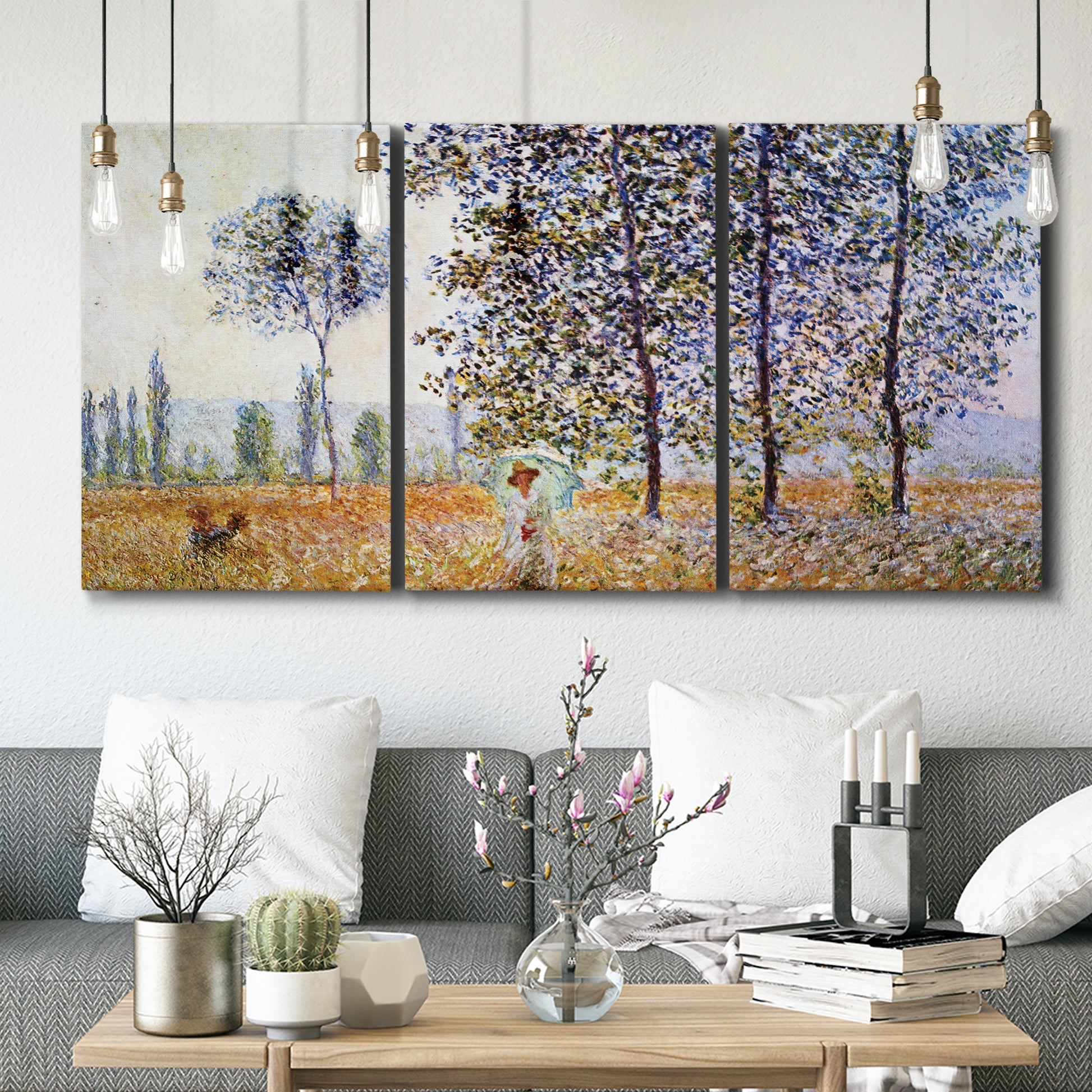 Three-panel canvas wall art featuring three poplar trees beside water, displayed in a modern living room above seating.