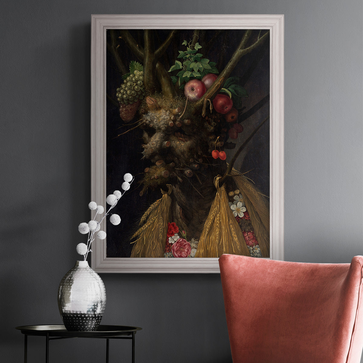 Surreal allegorical portrait representing the four seasons by Giuseppe Arcimboldo in an ornate weathered white frame displayed in a dark-toned interior setting.