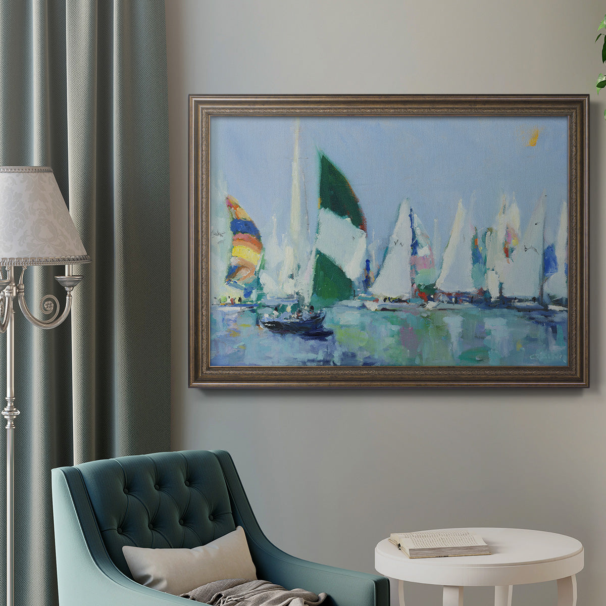 Coastal harbor watercolor painting in an ornate traditional bronze frame displayed in a neutral interior setting.
