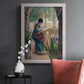 Impressionist portrait of Madame Monet sewing by Claude Monet in an ornate weathered white frame displayed in a dark-toned interior setting.