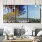 Three-panel canvas wall art featuring autumn poplar trees along river, displayed in a modern living room above seating.