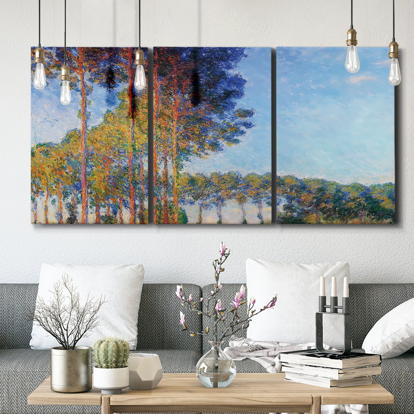Three-panel canvas wall art featuring autumn poplar trees along river, displayed in a modern living room above seating.