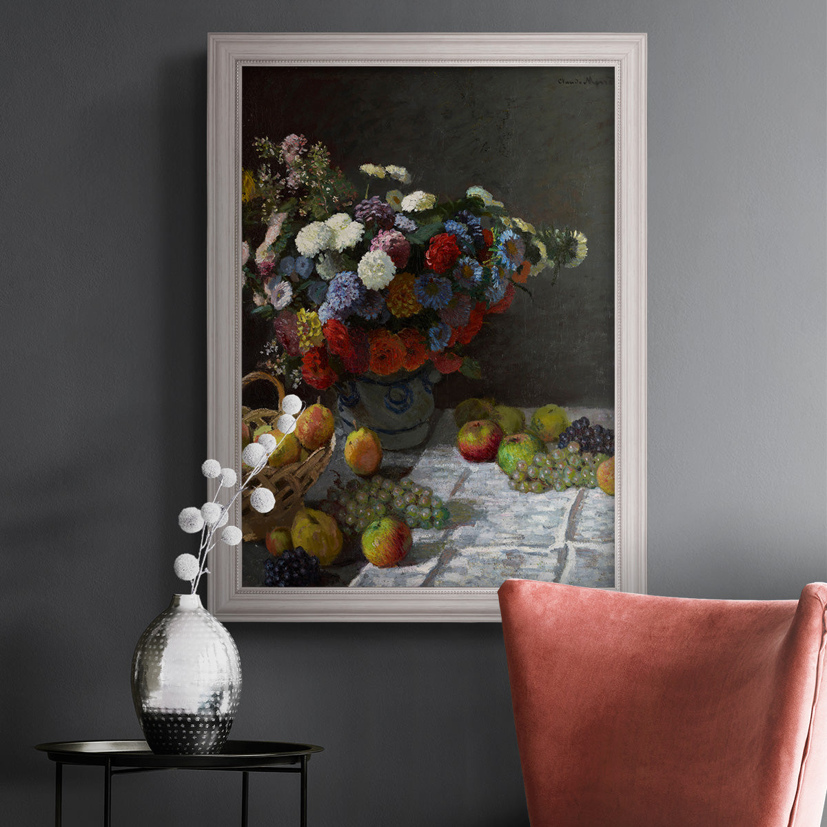 Impressionist floral still life painting by Claude Monet in an ornate weathered white frame displayed in a dark-toned interior setting.