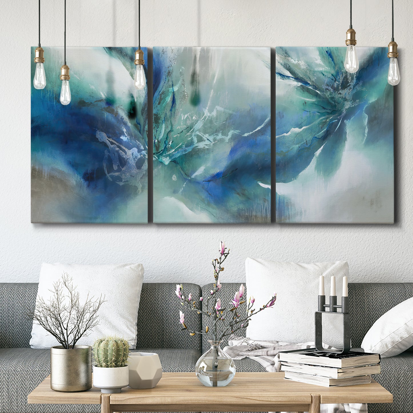 Three-panel canvas wall art featuring subtle abstract light flicker composition, displayed in a modern living room above seating.