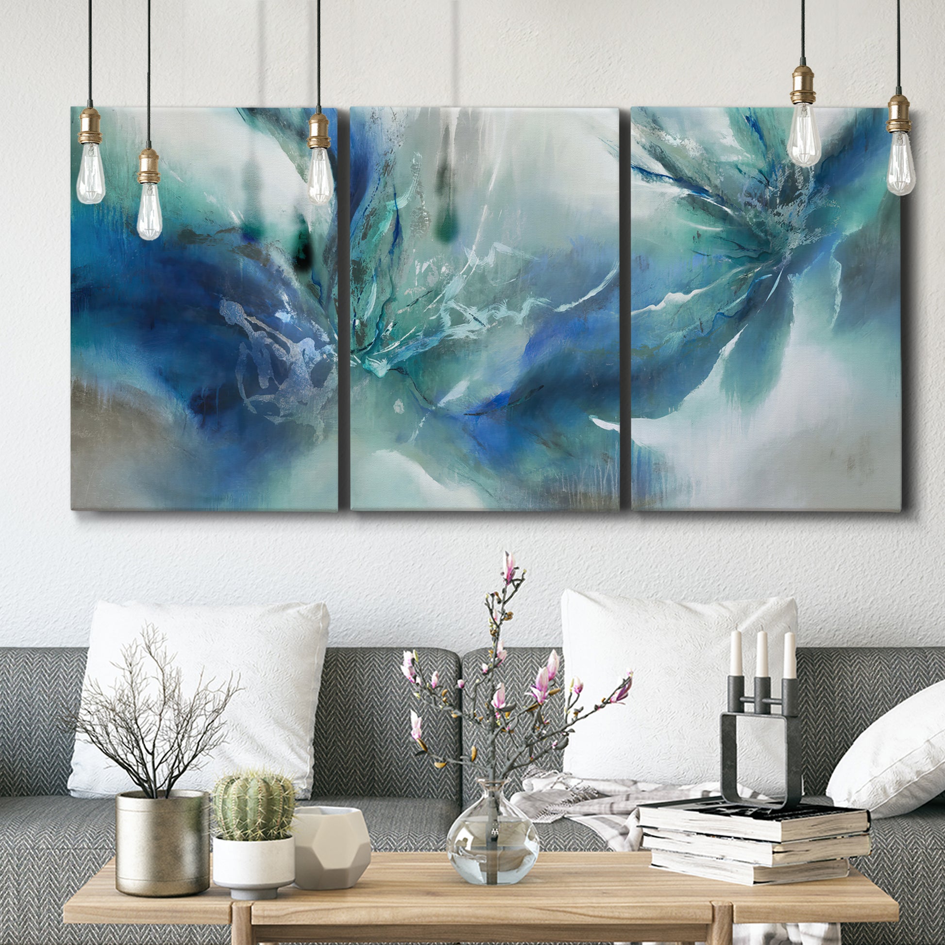 Three-panel canvas wall art featuring subtle abstract light flicker composition, displayed in a modern living room above seating.