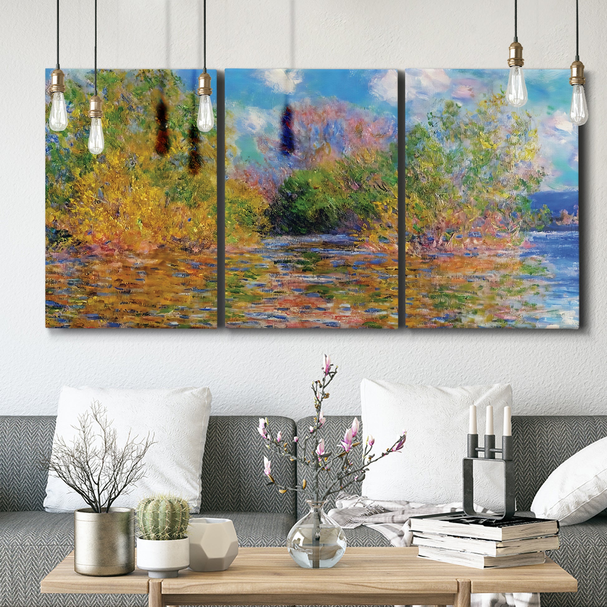 Three-panel canvas wall art featuring wide river landscape, displayed in a modern living room above seating.