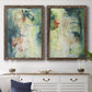 Set of two walnut barnwood framed canvas prints depicting a coordinated art pair of layered blue green cream and charcoal textures rendered as nature-inspired mixed-media abstracts above a dining room sideboard.